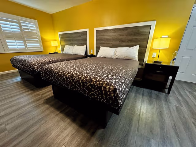 Double Queen Bedroom with Fireplace: Partial Ocean View