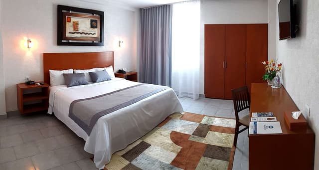 Suite-1 King Bed, Non-Smoking, Separate Living Area, High Speed Internet Access, Microwave And Refrigerator, Coffee Maker, Hairdryer