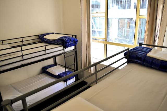 Bed in 4-Bed Female Dormitory Room with Shared Bathroom