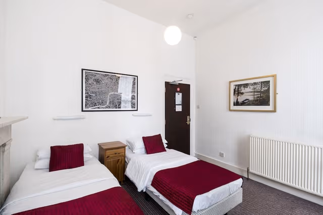 Twin room with shared bathroom