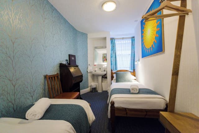 Twin room with shared bathroom