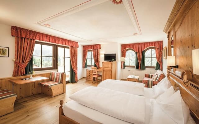 Superior room with balcony and Dolomite view