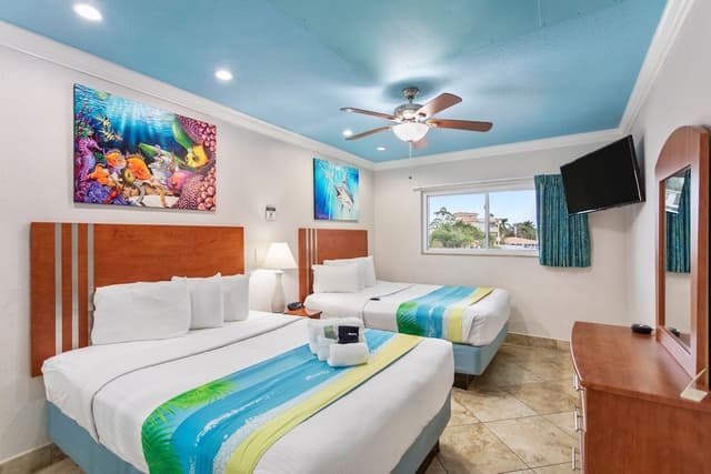 Deluxe One Bedroom Suite: 2 Queen Beds and 2 Sleeper Sofas