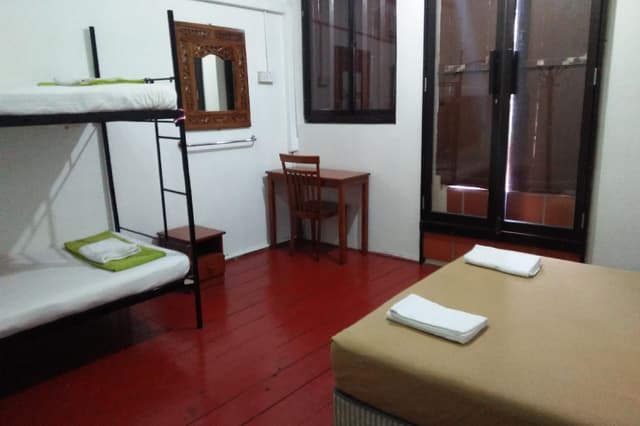 A Bed in All-Male Dormitory Bedroom
