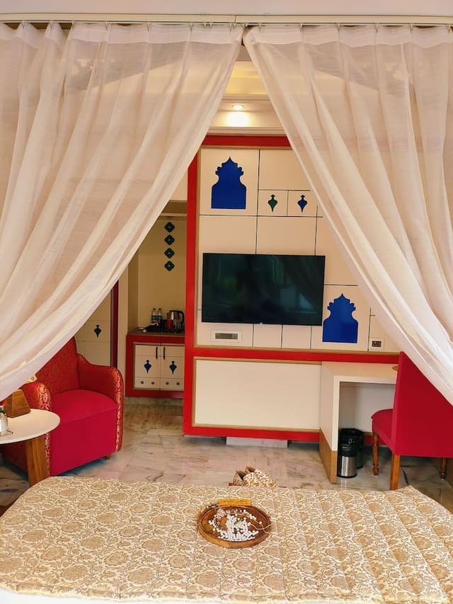 Mughal heritage room with 180 degree city view from Designer bed