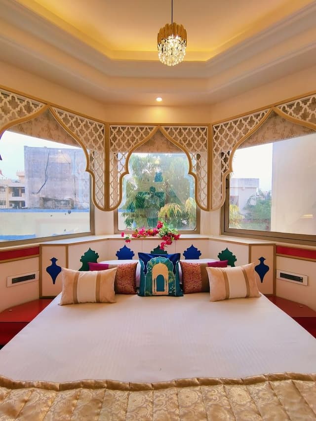 Mughal heritage room with 180 degree city view from Designer bed