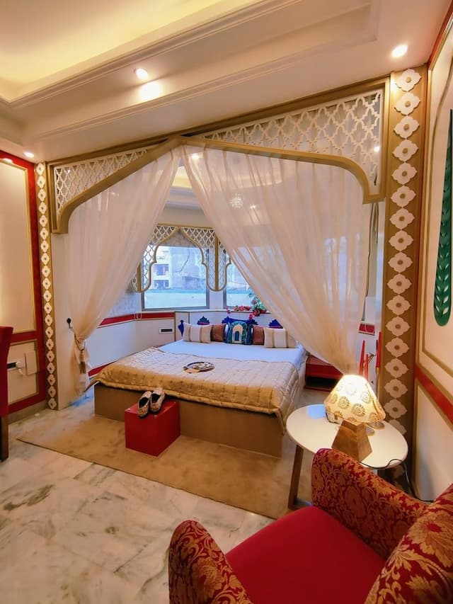 Mughal heritage room with 180 degree city view from Designer bed