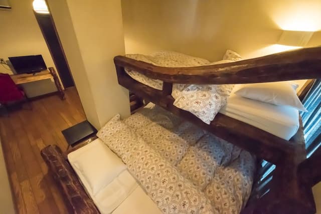 Woody Triple Log Bed with Shared Bathroom