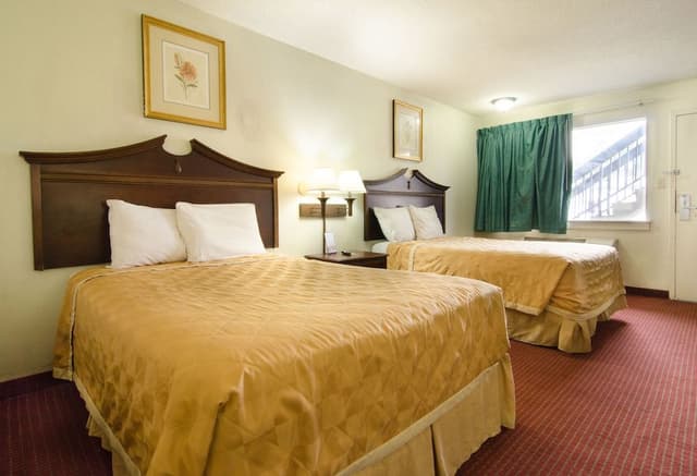 Room with Two Double Beds with Sofa Bed