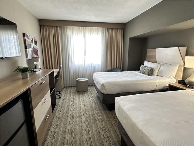 Suite-2 Double Beds, Non-Smoking, Executive Room, Separate Living Area, Balcony, Microwave And Refrigerator, High Speed Internet Access