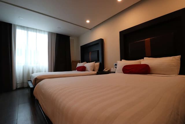 Suite-2 Double Beds, Non-Smoking, Sofa, High Speed Internet Access, Coffee Maker, Hairdryer, Iron And Ironing Board, Continental Breakfast