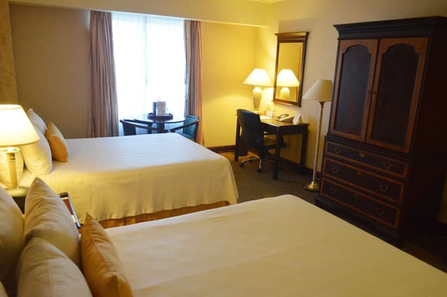 2 Double Beds, Non-Smoking, Hairdryer, Coffee Maker, Iron And Ironing Board, Two Phone Lines, Bathtub