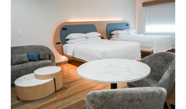 Premium Kitchenette Room with Two Queen Beds and Balcony