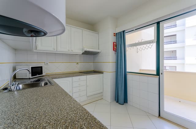 One-Bedroom Apartment with Side Sea View