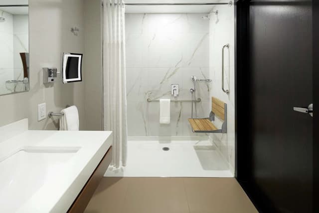 1 KING MOBILITY ACCESSIBLE ROLL IN SHOWER