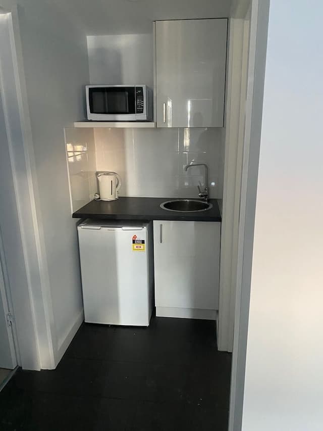 Family Room with King + 3 Single Beds + Kitchenette