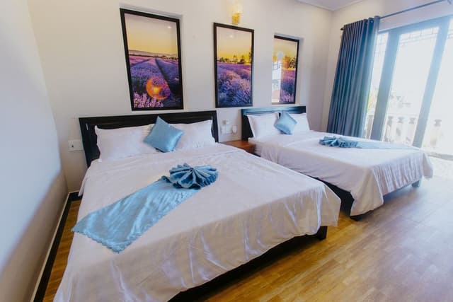 Deluxe Quadruple Room, 2 Queen Beds, Balcony, City View