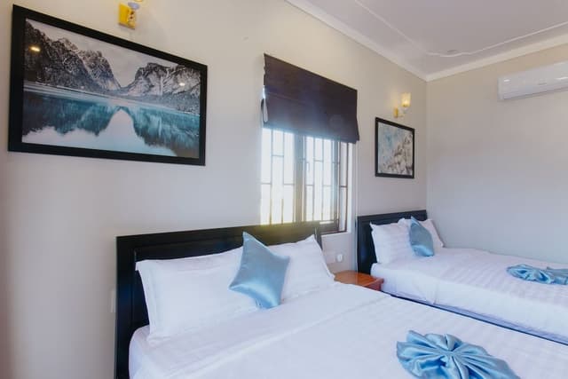 Deluxe Quadruple Room, 2 Queen Beds, Balcony, City View