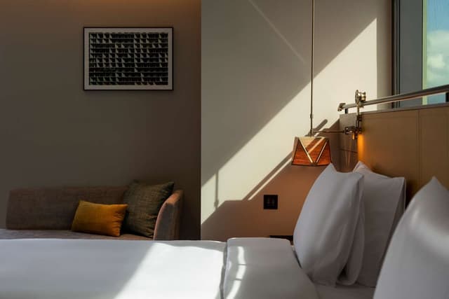TWIN CORNER ROOM WITH 2 SINGLE BEDS