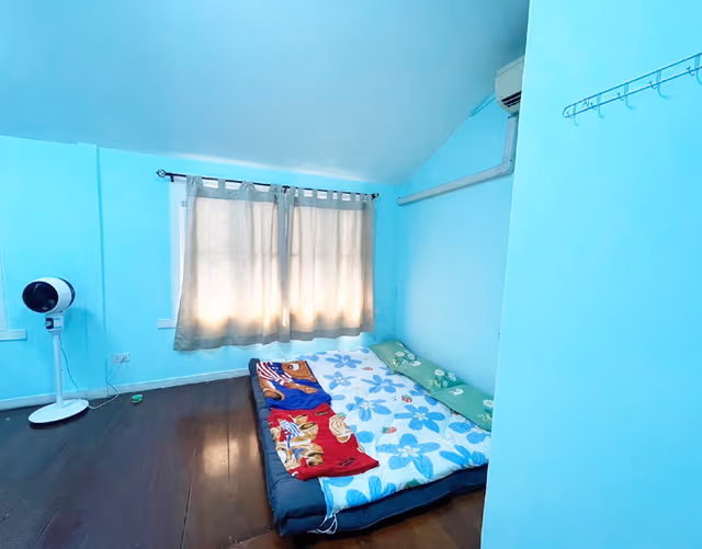 A Bed in All-Male Dormitory Bedroom