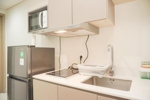Modern Look & Homey 1BR at Gold Coast By Travelio0