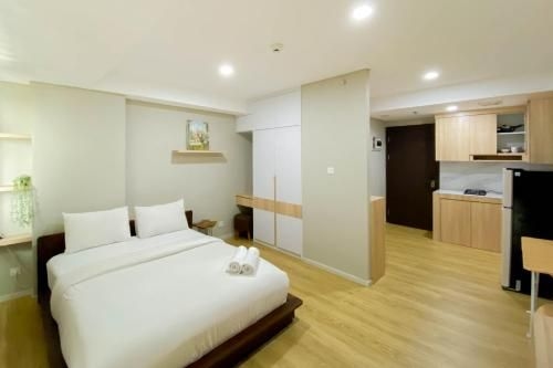 สตูดิโอกว้างขวาง ที่อพาร์ตเมนต์ดานโมกอตซิตี้ โดยทราเวลลิโอ (Spacious Studio Daan Mogot City Apt By Travelio)1