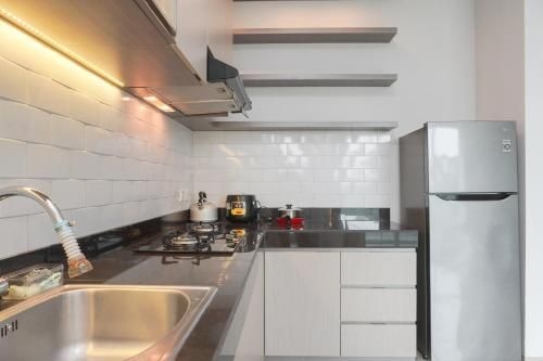 อพาร์ตเมนต์ 2 ห้องนอน สะดวกสบาย ซิตร้าเลค สวีท โดยทราเวลลิโอ (Comfy 2BR Apartment Citralake Suites By Travelio)0