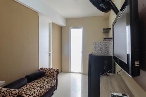 Strategic 1BR Bassura City Apartment By Travelio2