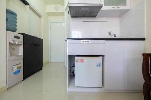 Tranquil 2BR @ Green Pramuka Apartment By Travelio0