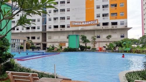 อพาร์ทเมนท์ 2 ห้องนอนใน เมืองปรามุคา กรีน ที่แสนสบายจาก ทราเวลลิโอ (Cozy Living 2BR Green Pramuka City Apt By Travelio)2