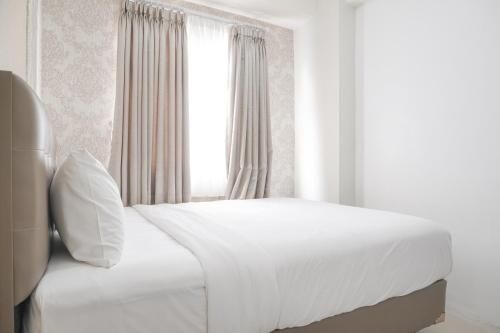 2BR ที่ได้รับการออกแบบอย่างดีที่ เมืองปรามุคา กรีน โดย ทราเวลลิโอ (WellDesigned 2BR at Green Pramuka City By Travelio)3