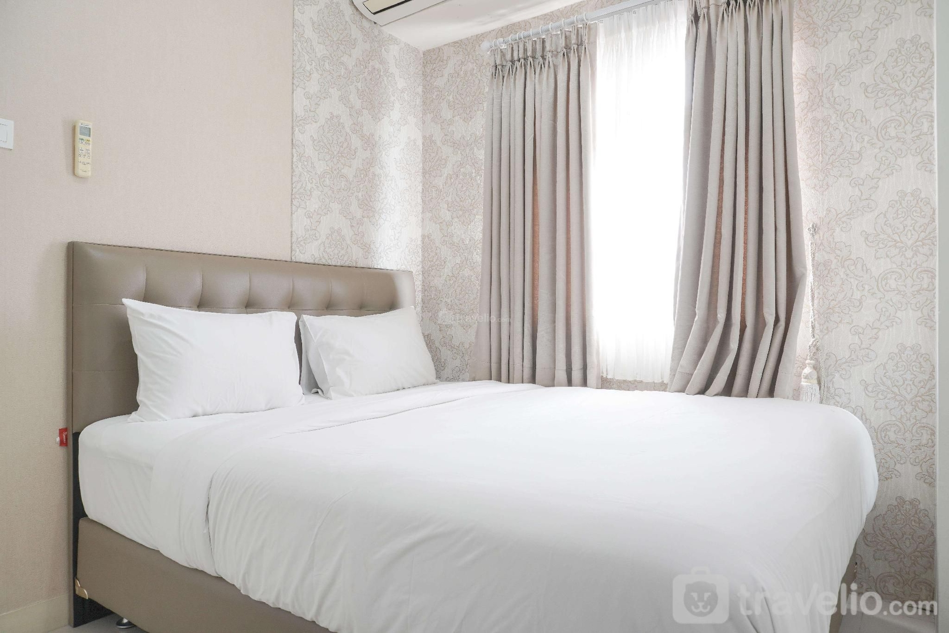 2BR ที่ได้รับการออกแบบอย่างดีที่ เมืองปรามุคา กรีน โดย ทราเวลลิโอ (WellDesigned 2BR at Green Pramuka City By Travelio)4