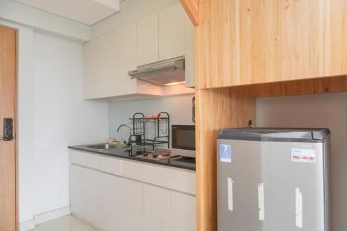 อพาร์ทเมนท์ลอฟท์กว้างขวาง 2 ห้องนอนบ้านพักมัคนาโดยทราเวลลิโอ (Spacious 2BR Loft Apt Maqna Residence By Travelio)4