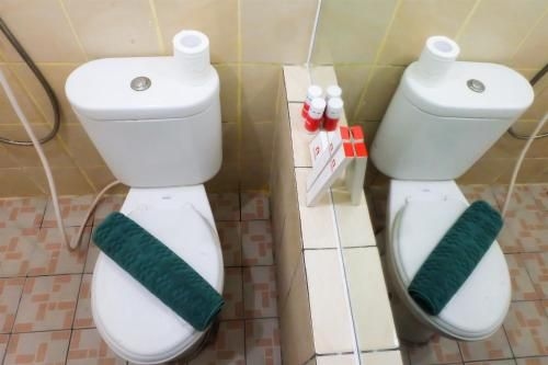 แอพาร์ทเมนต์ 2 ห้องนอน กรีน ปรามูกา พร้อมวิวสระว่ายน้ำ โดย ทราเวลลิโอ (Apt 2BR Green Pramuka with Pool View By Travelio)4