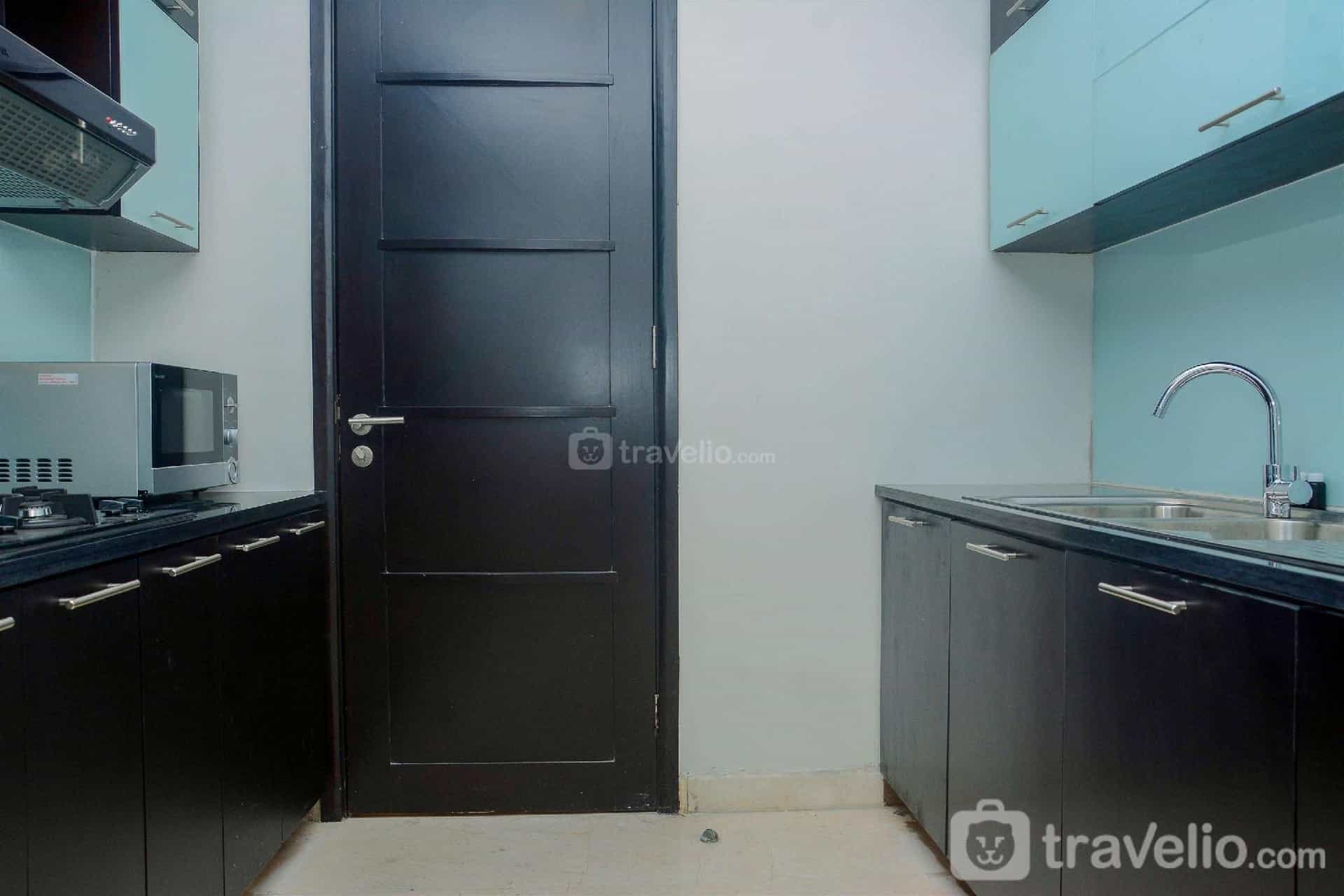 Comfy 2BR at The Masterpiece Apartment By Travelio