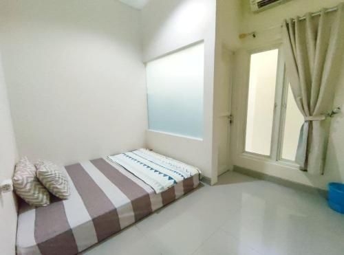 สุราบายา โฮมีย์ เนียร์ แอร์พอร์ต ชารีอะห์ (Surabaya Homey near Airport Syariah)1