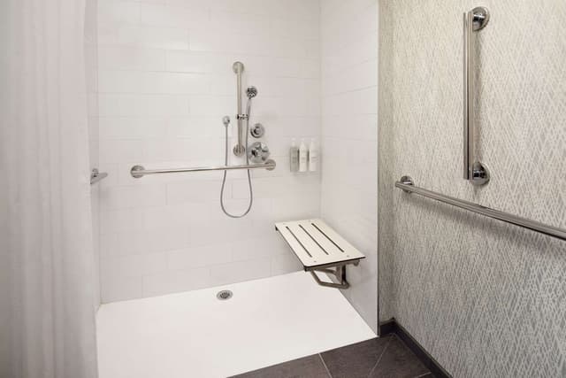1 QN MOB ACCESS CORNER ROLL IN SHOWER