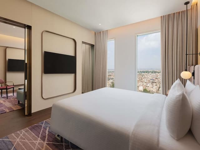 Junior Suite with King bed, city view, 15% F&B discount, 4 pieces laundry