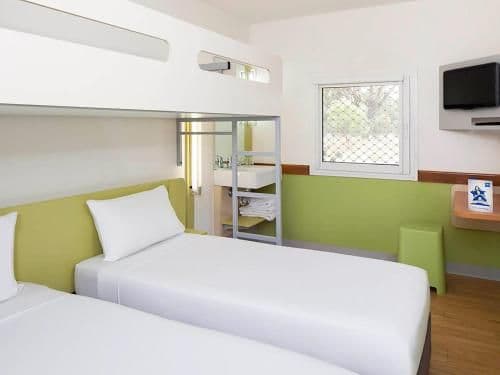 Standard Room with Two Single King Beds and Overhead Bunk