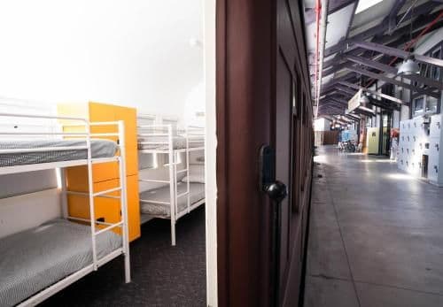 Bed in 8-Bed Male Dormitory Room with Shared Bathroom