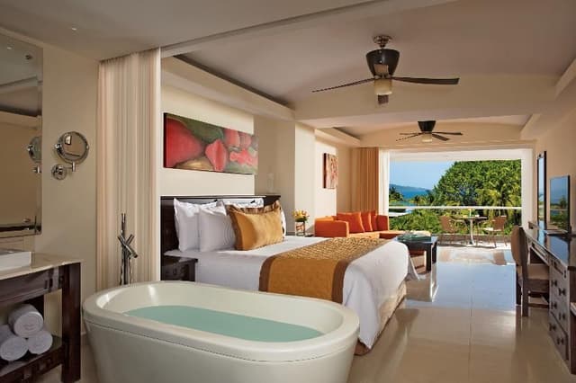JUNIOR SUITE PARTIAL OCEAN VIEW TWO DOUBLE BEDS