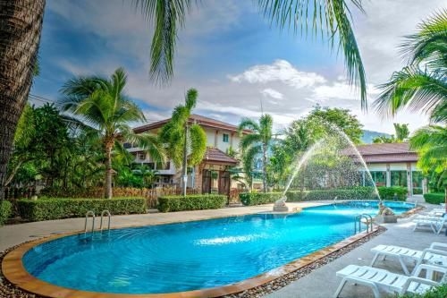 วิสเปอริ่ง ปาล์ม สวีท (Whispering Palms Suites)0