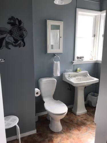 Queen Room 2 and en suite bathroom with shower. (2 Adults + 1 Child)