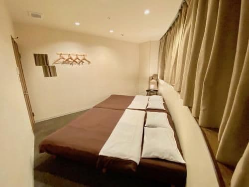 Twin Room with Two Double Beds and Shared Bathroom