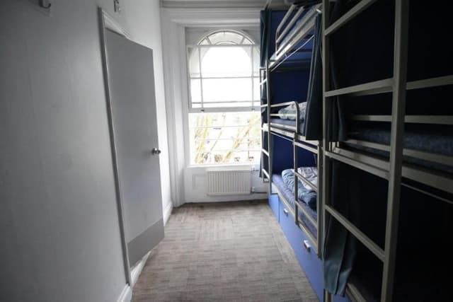 Bed in dormitory WITH SHARED BATHROOM
