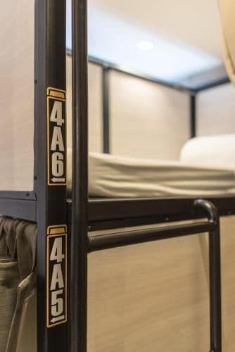 Bunk bed in mixed dorm with a bath room inside