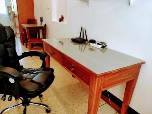 Studio with king bed, kitchen and balcony4