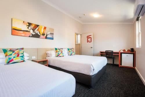 Economy Twin Queen with Shared Facilities and Free Welcome Drink For Two Guests