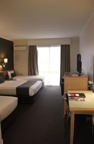 Deluxe Queen Room with One Queen and Two Single Beds