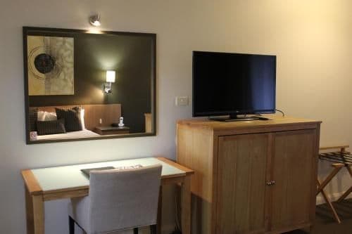 Deluxe Queen Room with One Queen and Two Single Beds